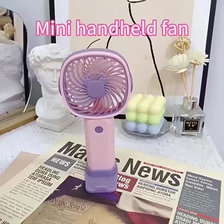 A Usb-Powered Portable Fan with Three Speed Settings. This Compact Desktop Fan Can Also Function As a Phone Holder When Used with Its Base. It'S a Lightweight And Efficient Cooling Option That Can Additionally Action As a Phone Stand When Paired Wit - Image 10